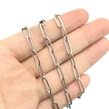 Polished silver stainless steel paperclip chain links held in hand for jewelry DIY - Steel Color 1X4.3X12mm