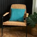 Square teal velvet pillowcase with diamond quilted texture on a woven chair - Teal