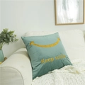 Sage green velvet throw pillow featuring yellow Keep Smile embroidery on a white sofa - Lake Green