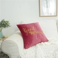 Rose pink velvet throw pillow with gold Good Morning embroidery on a white sofa - Watermelon red