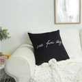 Square black pillow cover with white One Fine Day embroidery on a white sofa - Black