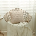 Pink geometric diamond plush pillowcase with textured velvet finish on a gold chair - 65x65 / Apricot