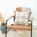 Beige and cream checkered cotton linen pillow cover with tassels on a woven chair - Beige Plaid