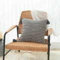 Grey and beige striped cotton linen cushion cover with tassel details on a chair - Taupe Stripe