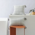 Gray and white plaid woven throw pillow with decorative tassels and texture - City Gray