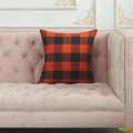 Square throw pillow cover featuring classic orange and black buffalo plaid pattern on sofa - Standard Square Pillowcase