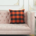 Modern orange and black buffalo plaid decorative square pillow on a velvet sofa - Medium Large Square Pillowcase