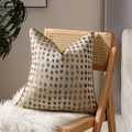 Champagne decorative pillow cover with golden metallic dots and piped edges on a wooden chair - Gold Polka Dots