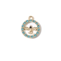 Colgante redondo de circón dorado con cristales azules y relieve de águila sobre blanco - Patrón de Águila Tono Dorado con Zirconia Azul