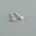 Macro view of minimalist S925 sterling silver stud earrings with square-cut zircon - Square White Zirconia (Platinum) / 925 Silver