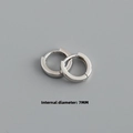 Macro shot of silver huggie earrings showing the precise 7mm internal diameter - Inner 7mm / White Gold