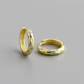 Macro shot of S925 gold-plated earrings with hollow star patterns and blue gemstones - Gold (Turquoise)
