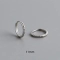 Detailed macro view of 11mm S925 sterling silver hoop earrings with textured dotted design - Inner Diameter 11mm / White Gold