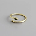 Macro shot of gold adjustable ring with marquise black stone and pavé black zircons - Adjustable Open / Gold with Black Stone