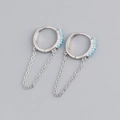 Detail of silver drop earrings with blue stones and delicate hanging chain tassels - 925 Silver / Blue Turquoise Silver