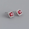 Detail of square halo stud earrings with a red center stone and silver base - Ruby Red (Silver)