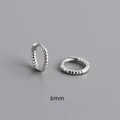 Macro view of 6mm twisted rope silver hoop earrings in S925 sterling silver - Number 6 / White Gold