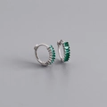 Macro detail of silver earrings with emerald green baguette zircons in a channel setting - 925 Silver / Emerald Green (Silver)