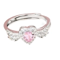 Adjustable angel wing ring featuring a pink heart stone and pink enamel coating - Pink Heart Angel Wings (1)