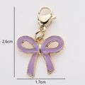 Purple enamel bow charm with golden metal edges and lobster clasp for DIY jewelry - Purple Bow (1)