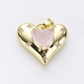 Golden heart-shaped pendant with a pink gemstone center and zircon starburst accents - Pink Heart Gemstone Embellished Style (14)