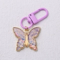 Goldener Schmetterling-Schlüsselanhänger mit violettem Sternenhimmel-Emaille-Effekt - Violett