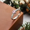 Silver adjustable ring featuring a pink heart zircon center and side stone accents - Three Prong Heart Pink Main Stone Side Stones Style (5) / Open Adjustable / Silver