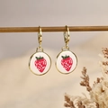 Cute strawberry hoop earrings with golden clips and white enamel finish for daily wear - Strawberry Style