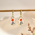 Vintage gold oval drop earrings with orange floral patterns on white background - Orange Floral Style (3)