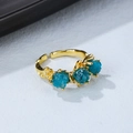 Detailed macro view of three raw blue apatite stones on a textured 18K rose gold plated ring - Adjustable Open / Rose Gold + Deep Blue (ZT-02)