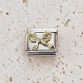 Italian modular charm featuring a gold bow design on a silver stainless steel base - Hammered Gold Bow Style (25)