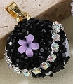 Ball-shaped pendant with black crystals, purple cat-eye flower, and gold clasp - Black