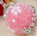 Pink sugar bead round pendant with a white flower and pearl accent in variant style - Peach