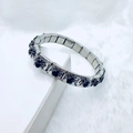 Macro shot of stainless steel gothic spider bracelet with black rhinestones details - Silver Black Spider Style
