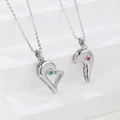Matching heart pendant necklaces for couples with green and red inlaid gemstones - Silver