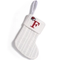 White knitted Christmas stocking with red letter F embroidery and a small Santa hat detail - Letter F