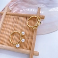 Elegant gold flower ring set with pearls on a bamboo display with a seashell accent - Gold Open Ring (No Pearl)