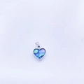 Macro detail of heart-shaped copper pendant with colorful abalone shell inlay - Silver Tone Convex Abalone Shell Large Heart