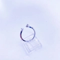 Detail of adjustable silver twist ring featuring exquisite pearl-like ends on a clear stand - White Gold Rose Flower