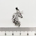 Macro detail of unicorn pendant charm with white zircon stones and red eye inlay - Zirconia Inlaid Unicorn / White Gold