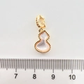 Detail of a 15mm gold-plated gourd pendant with pink mother-of-pearl and zirconia accents - Gourd Without Diamonds