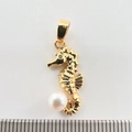 Macro view of gold-plated seahorse pendant with white pearl and sparkling zircon stone - Golden Seahorse