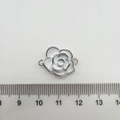 Macro detail of a 1.8cm white enamel camellia charm with silver outlines and dual loops - White Camellia Medium (Silver Color)