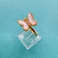 Detailed close-up of a butterfly ring featuring pink wings and crystals on a gold base - White Shell Style / Ring White Mother of Pearl