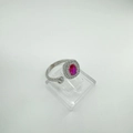 Detailed macro view of adjustable silver ring with oval ruby gemstone and halo zircon setting - Ring-Silver