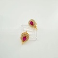 Detail of gold oval earrings featuring red zirconia center stones and white halo settings - Earrings-Gold-Pair