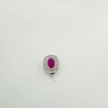 Macro view of a 925 silver pendant with red oval gemstone and double zircon halo - Pendant-White Gold