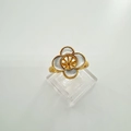 Detailed close-up of a gold-plated four-leaf clover ring with iridescent shell petals - Ring Blanks