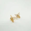 Macro detail of 18K gold plated butterfly studs with white wings and zircon inlay - Earrings-Gold