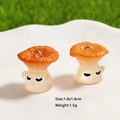 Close-up of resin mushroom charms with cute faces, size 1.6x1.4cm for DIY jewelry - Orange Mushroom